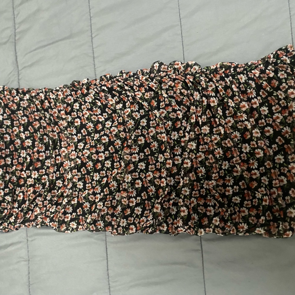 Short mini dress. Strapless. Women’s size small. Black with floral patterns.